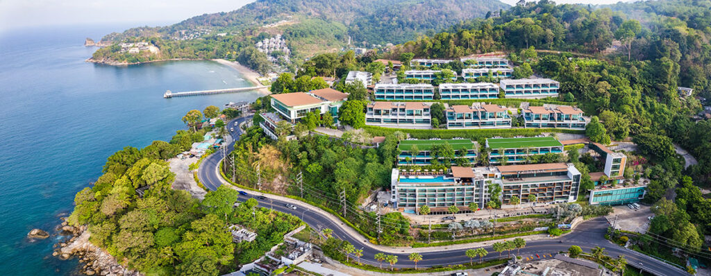 Aerial view of luxury waterfront villas in Phuket, showcasing high-end real estate development with modern infrastructure and lush tropical surrounding