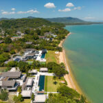 Scenic view of Cape Yamu, Phuket, showcasing its tranquil waterfront, lush greenery, and stunning coastal landscape.