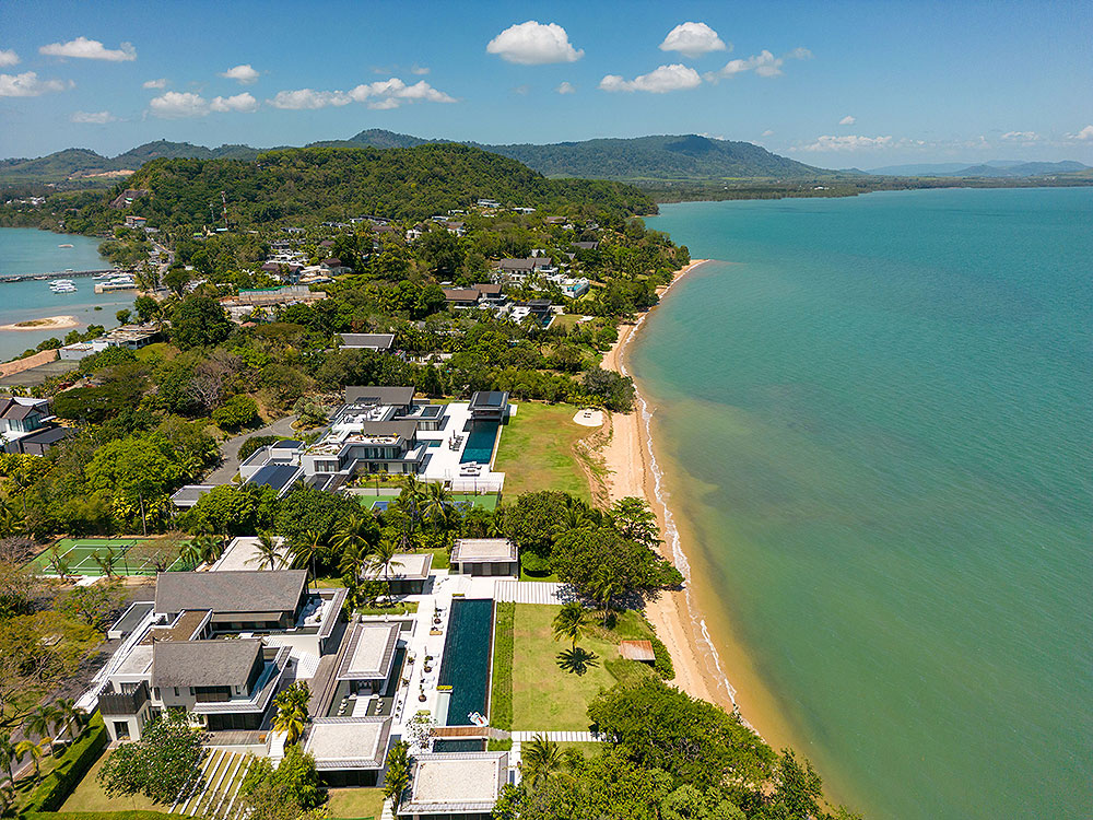 Scenic view of Cape Yamu, Phuket, showcasing its tranquil waterfront, lush greenery, and stunning coastal landscape.