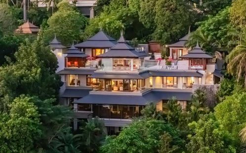 A six-bedroom ultra-luxury villa in Cherng Talay, Phuket, offering a private 21m pool, traditional Thai architecture, and stunning Andaman Sea views.